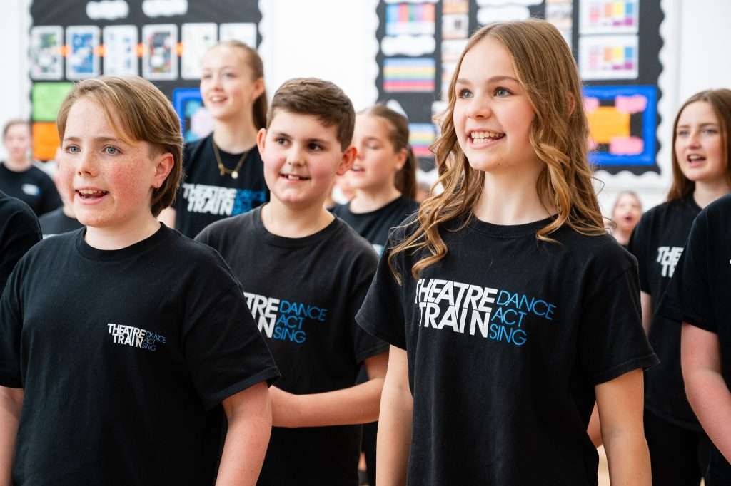 Children taking part in drama, dance and singing classes building confidence and creativity