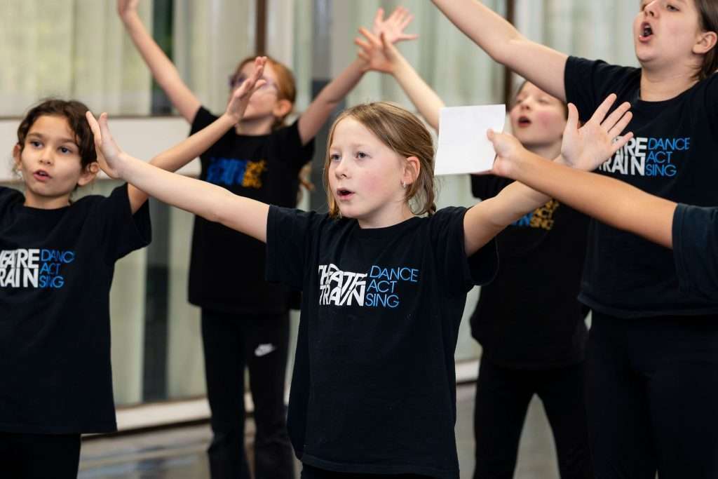 Young people developing communication and teamwork skills through performing arts at Theatretrain