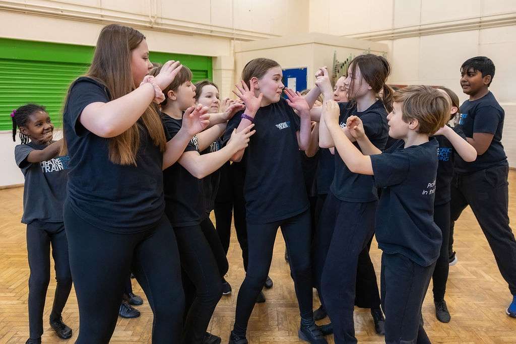 Children working together in an ensemble performance at Theatretrain Maldon in Essex.