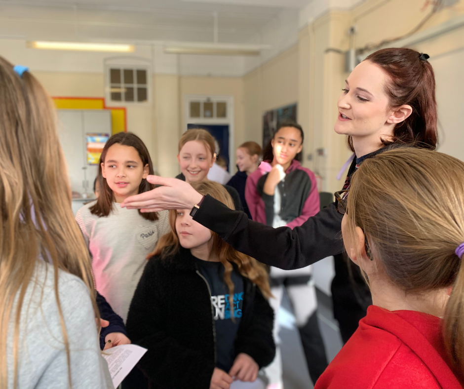 Theatretrain Letchworth Blog and Events 8 A teacher encouraging a child after making a mistake during a dance class, showing that mistakes are a normal part of learning.